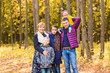 © satura_ - family, childhood, season and people concept - happy family in autumn park