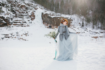 Wall Mural - Portrait of a girl dressed in a winter image of a bride with a b