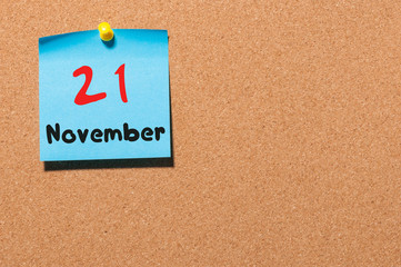 November 21st. Day 21 of month, color sticker calendar on notice board. Autumn time. Empty space for text