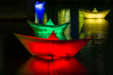 Paper Illuminated Boats On The Water.