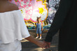 © IVASHstudio - Look over man and woman holding each other hands at little child