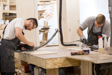 two carpenter polishes boards