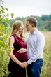 © demchyna - Portrait happy and loving pregnant couple in nature