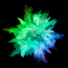 Explosion Of Colored Powder On Black Background