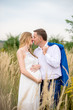 © demchyna - Portrait kissing family in anticipation of the baby. Soft and romantic in nature photography