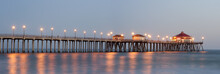 Panorama Of Huntington Beach Pier Lit Up By Street Lights At Dusk 