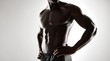© Jacob Lund - African man with muscular body on grey background