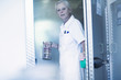 © Connect Images - Scientist carrying rack with petri dishes in laboratory