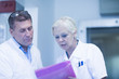© Connect Images - Scientists reading test results in laboratory