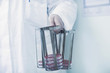 © Connect Images - Scientist carrying rack with petri dishes in laboratory