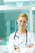 © pressmaster - Portrait of a young doctor in medical goggles looking at camera and smiling