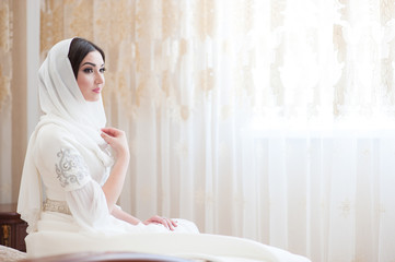 beautiful caucasian bride in traditional dress