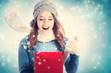 Wall Mural - Happy young woman with Christmas present box