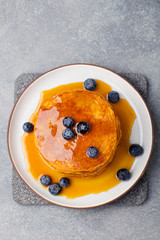 Wall Mural - Pumpkin pancakes with maple syrup and blueberries