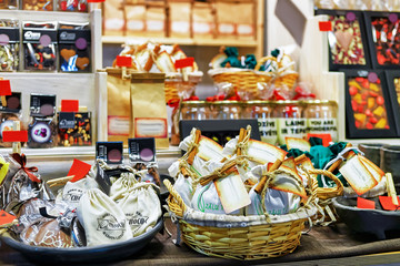 Poster - Chocolate sweets on shelves and baskets at Riga Christmas market