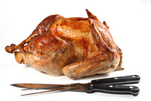 Roast Turkey With Carving Fork And Knife, Isolated On White Back