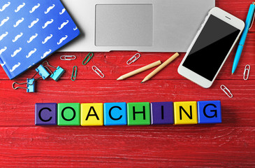 Wall Mural - Coaching concept. Wooden cubes on table