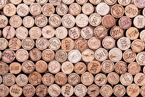 Fototapeta na wymiar stacking wine cork background with vintage years