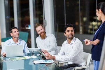 Wall Mural - Businesswoman interacting with colleagues