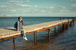 © 6okean - Attractive hipster girl with back pack enjoying her holidays.