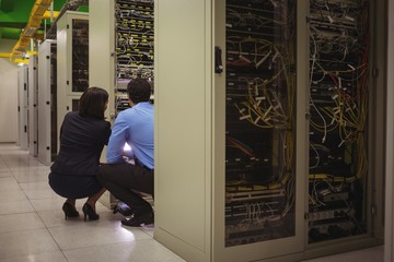 Poster - Technicians analyzing server