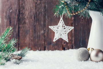 Composition with Christmas decorations in vase on dark wooden background