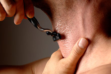 Close Up Man Shaving With Razor And Gel On Throat Neck
