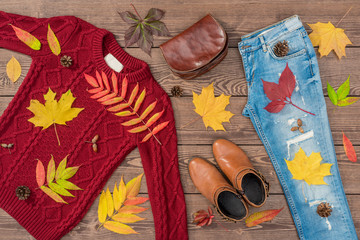 Wall Mural - Women's autumn outfit on wooden background