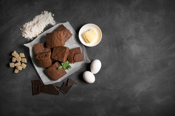 Chocolate brownie cake and ingredients of tart