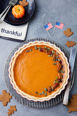 Wall Mural - Pumpkin pie, tart with American flag Top view
