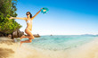 © Jag_cz - Beautiful woman jumping over beach background