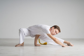 Young man doing stretching exercises