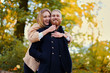 © Fxquadro - Bearded male hugs the cute blonde female on the date.