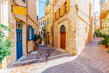 Fototapeta Uliczki - Venetian architecture in narrow stone streets of old town Chania in Crete, Greece