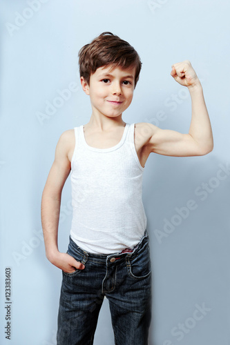 Sportliches Kind Ist Kraftig Und Gibt Mit Seinen Muskeln An Buy This Stock Photo And Explore Similar Images At Adobe Stock Adobe Stock