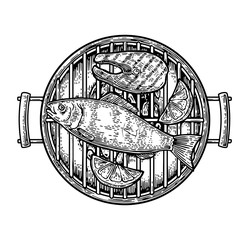 Barbecue grill top view with charcoal, fish steak and lemon