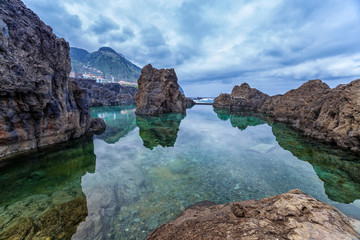 Wall Mural - Natural volcanic pools with sea water in Porto Moniz, Madeira, Portugal.