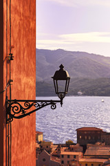 Elba, Portoferraio street lamp view on the sea on sunset. Tuscan