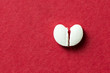 Heart shaped pill cracked in half