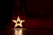 © Glebstock - Photo of golden star with light bulbs on red velvet curtain on stage