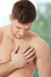 © Piotr Marcinski - Athletic man feeling pain in his chest.