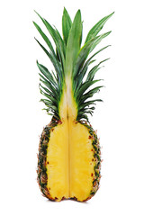 Wall Mural - Ripe whole pineapple with a quarter cut isolated on white background.