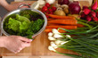 © lenetsnikolai - Cook's hands preparing vegetable salad - closeup shot