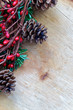 Christmas decorations on a rustic log with space for text