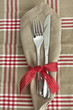 Knife and fork with checked tablecloth