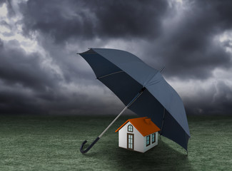 House insurance concept, house protected under umbrella, residential home real estate protection