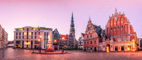 City Hall Square with House of the Blackheads and Saint Peter church in Riga Old Town During sunset time Fotobehang