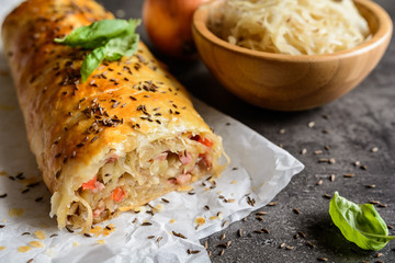 Savory strudel stuffed with sour cabbage, bacon, red pepper and onion