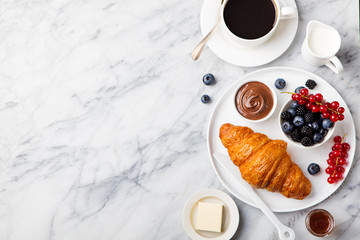 breakfast with croissant with cup of coffee