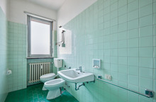 Old Bathroom Interior With Green Tiles